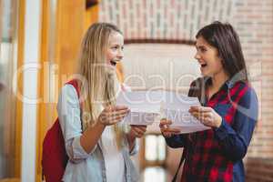 Smiling students looking at results