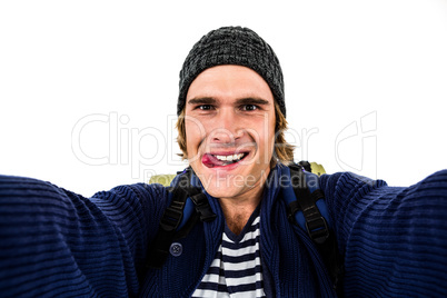 Backpacker holding the camera and grimacing