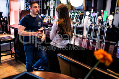 Couple talking in a bar