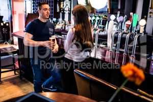 Couple talking in a bar
