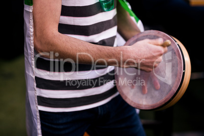 Man playing tambourine