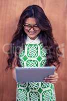 Smiling Asian woman using tablet