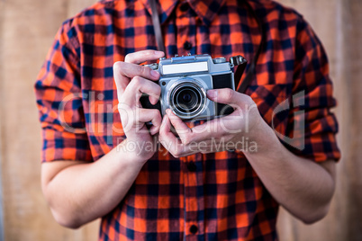 Hipster holding an old camera