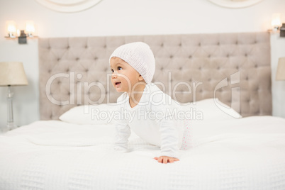 Smiling baby on bed