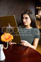 Attractive brunette checking menu