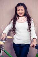 Asian woman holding bike