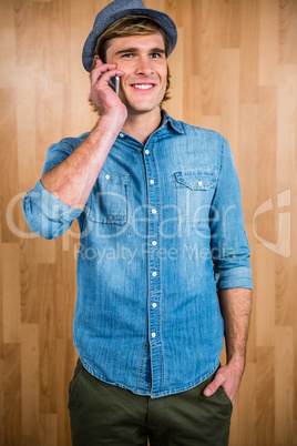 Smiling blonde hipster phone calling