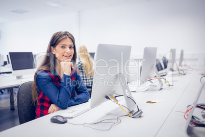 Smiling student working on computer