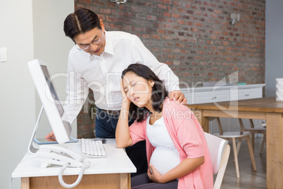 Husband comforting his suffering pregnant wife