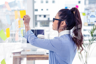 Businesswoman holding disposable cup and looking at wall with no