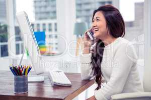 Smiling businesswoman on phone call