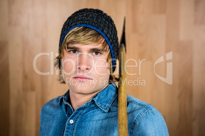 Close up of hipster standing with axe