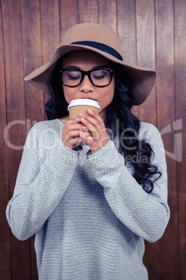 Asian woman drinking by disposable cup