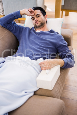 Sick man lying on the couch