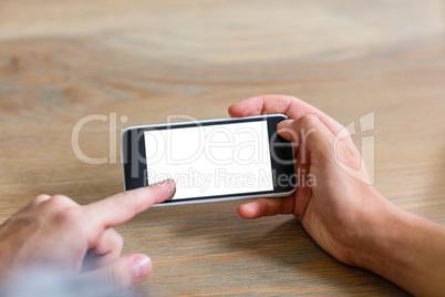 Focused couple using smartphone