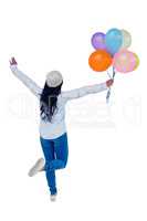 Asian woman holding colorful balloons