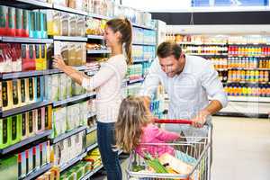 Happy family doing shopping