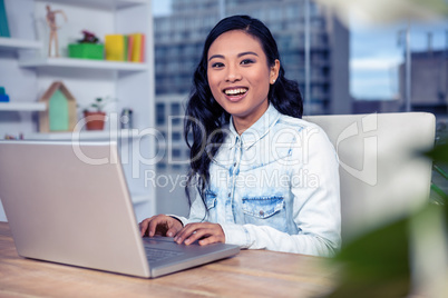 Asian woman using laptop