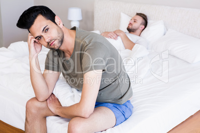 Angry couple gay in bedroom