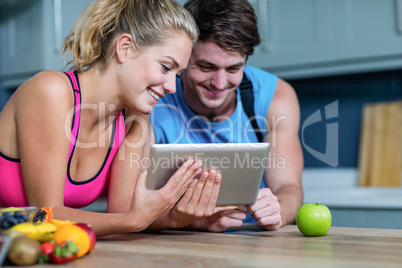 Healthy couple looking at tablet