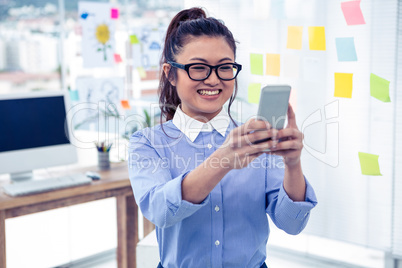 Asian businesswoman using smartphone