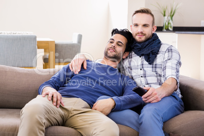 Gay couple watching television