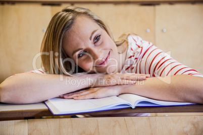 Happy female student daydreaming