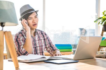 Hipster businessman on phone call