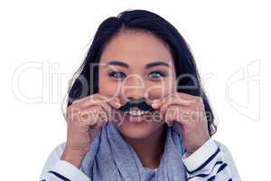 Pretty Asian woman with fake mustache posing for camera
