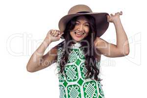 Happy Asian woman wearing hat