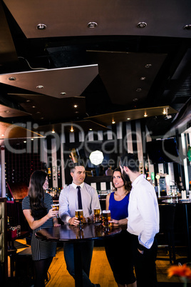 Friends talking and having a beer