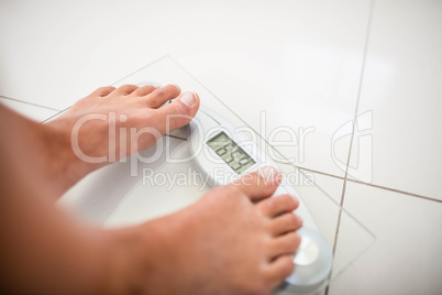 Feet of woman on weighting scale