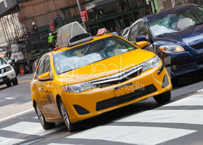 Classic street view with yellow cab in New York city