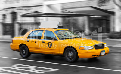 Yellow cab in Manhattan in a rainy day.