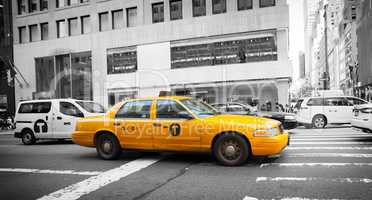 Yellow cab in Manhattan with black and white background
