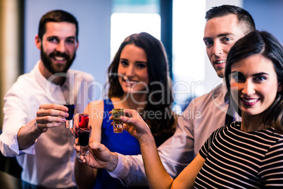 Friends toasting with alcohol shots