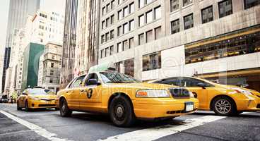 Classic street view with yellow cabs in New York City
