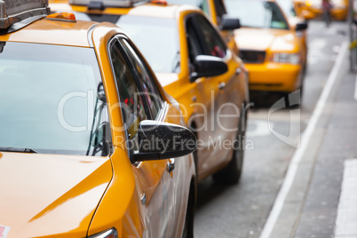 Classic street view of yellow cabs in New York city