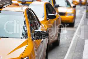 Classic street view of yellow cabs in New York city