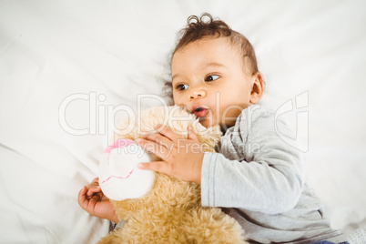 Cute baby holding plush