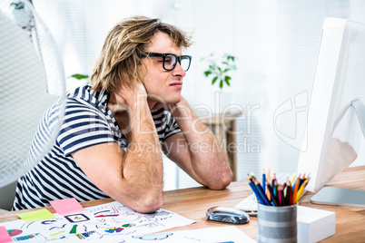 Troubled hipster businessman sitting in his office