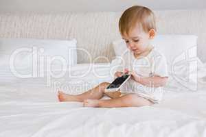 Cute baby using smartphone