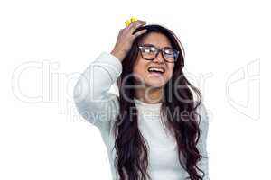 Asian woman with paper crown posing for the camera