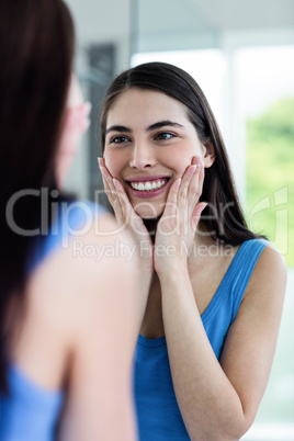 Smiling brunette in bathroom