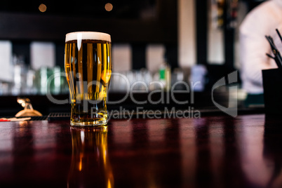 Close up of pint of beer on counter