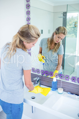 Woman cleaning the sink