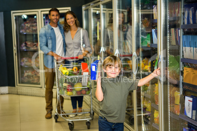 Cute family doing grocery shopping together