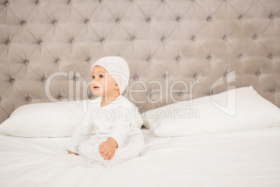 Smiling baby on bed