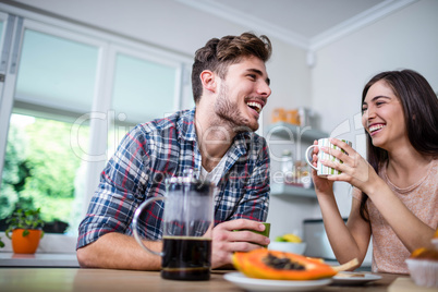 Happy couple having breakfast together