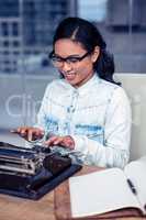 Asian woman typewriting